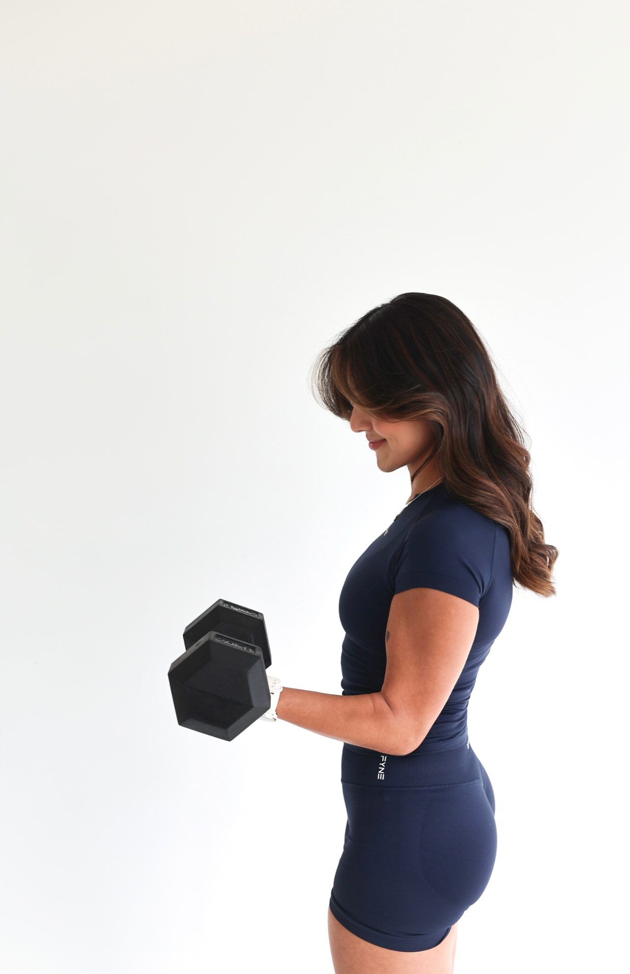 Team Strive client training with a dumbbell